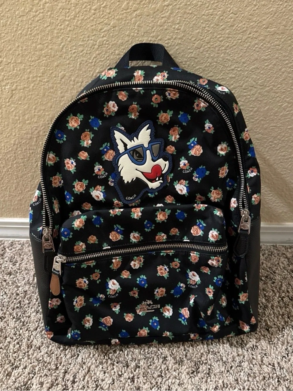 Coach Black Floral Backpack with Wolf Patch